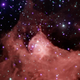 A wispy red molecular cloud in the Milky Way.